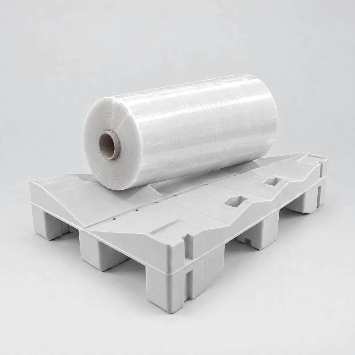 Plastic reel pallet with a film reel resting in the cradle